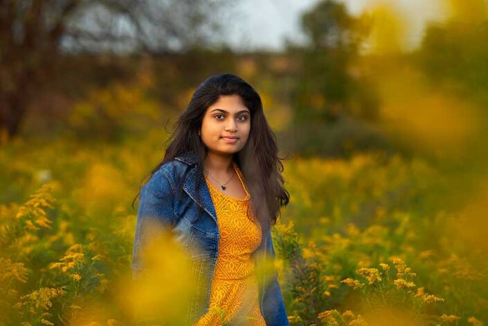 Naperville family photographer girl yellow flower blue jacket