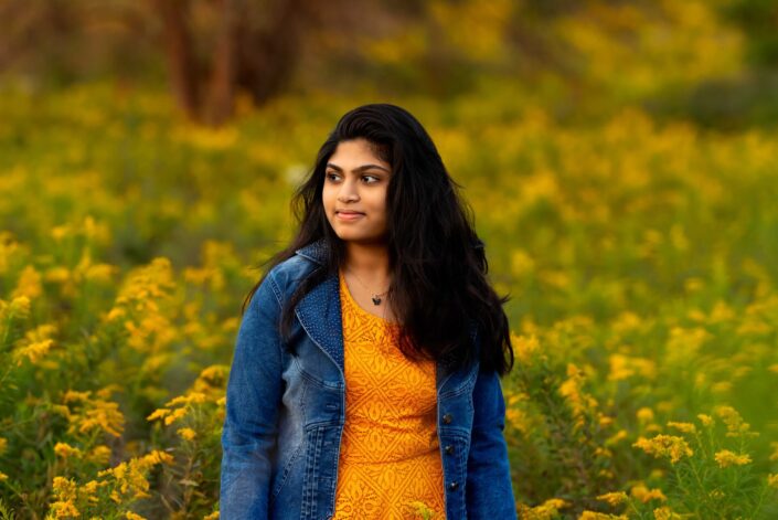 Naperville family photographer girl yellow flower blue jacket